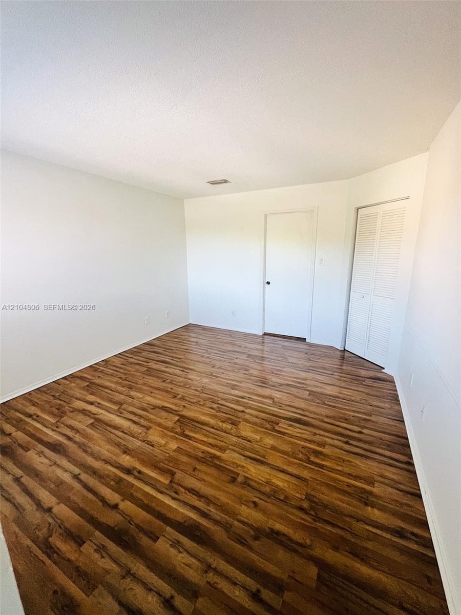 Wood-finish flooring with white walls