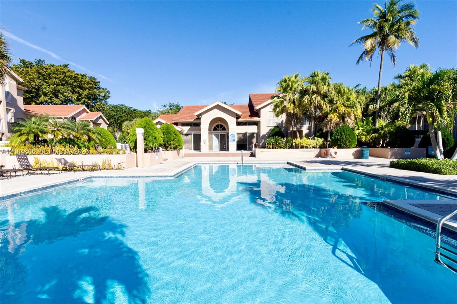Expansive outdoor swimming pool with surrounding deck