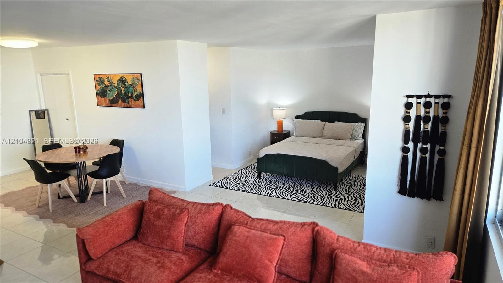 Open-concept layout with tile flooring