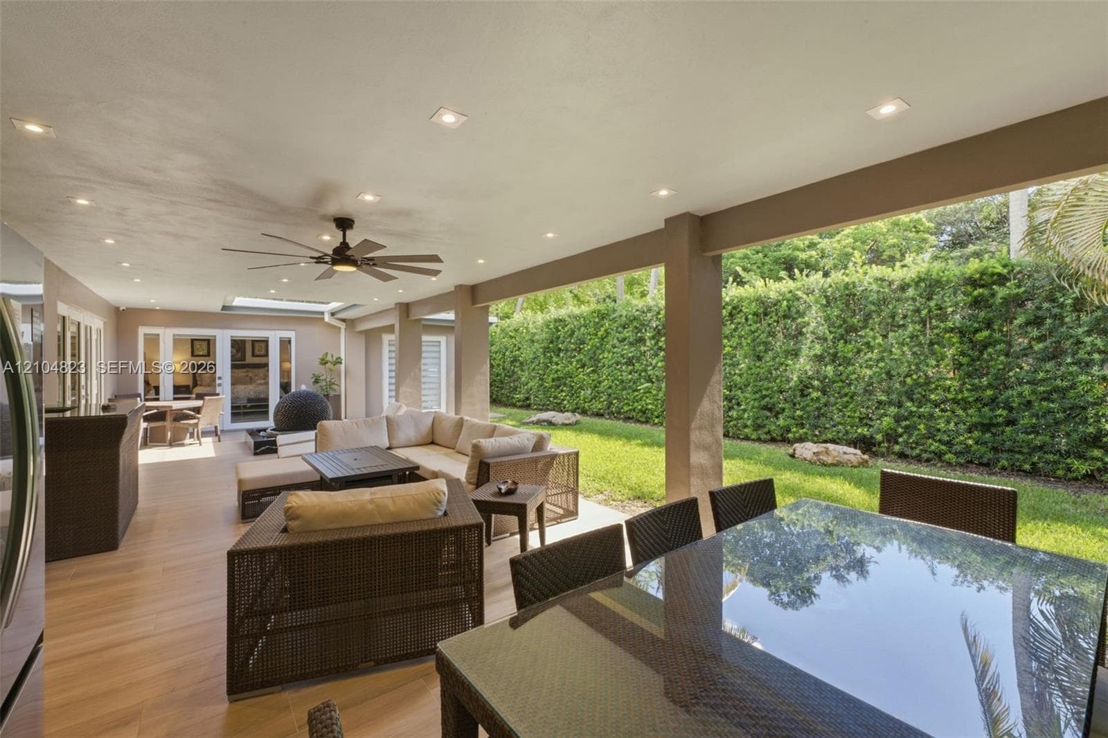 Covered outdoor living space featuring recessed lighting and a ceiling fan