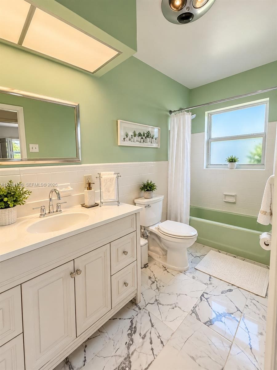 White vanity with integrated sink, chrome faucet, and storage cabinetry