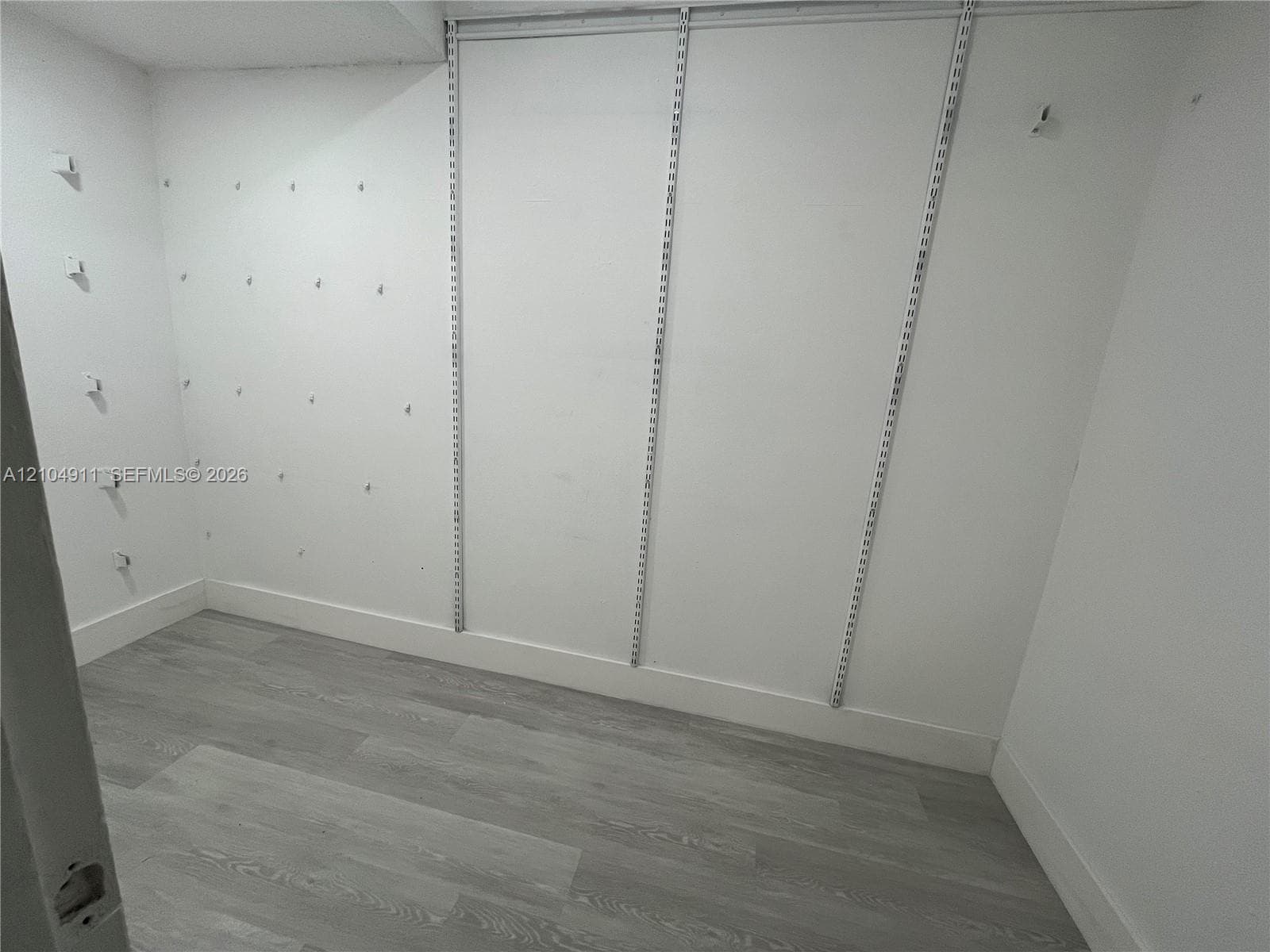 Primary bedroom walk in closet