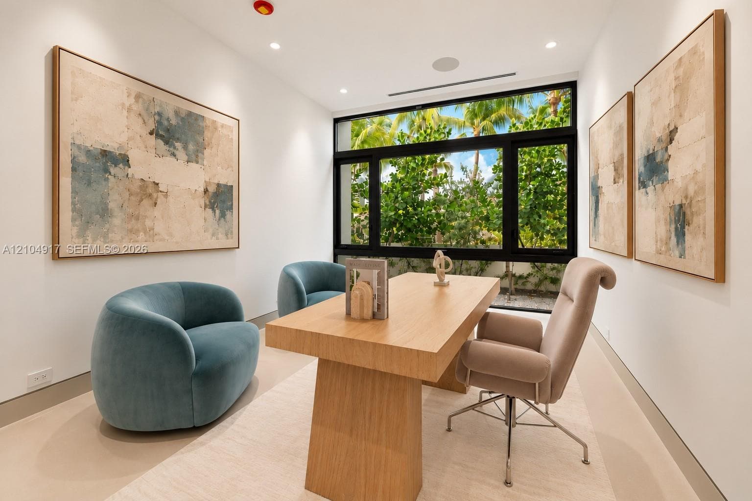 Recessed ceiling lighting, full-height windows with dark frames, wood-finish flooring, and a built-in ceiling speaker