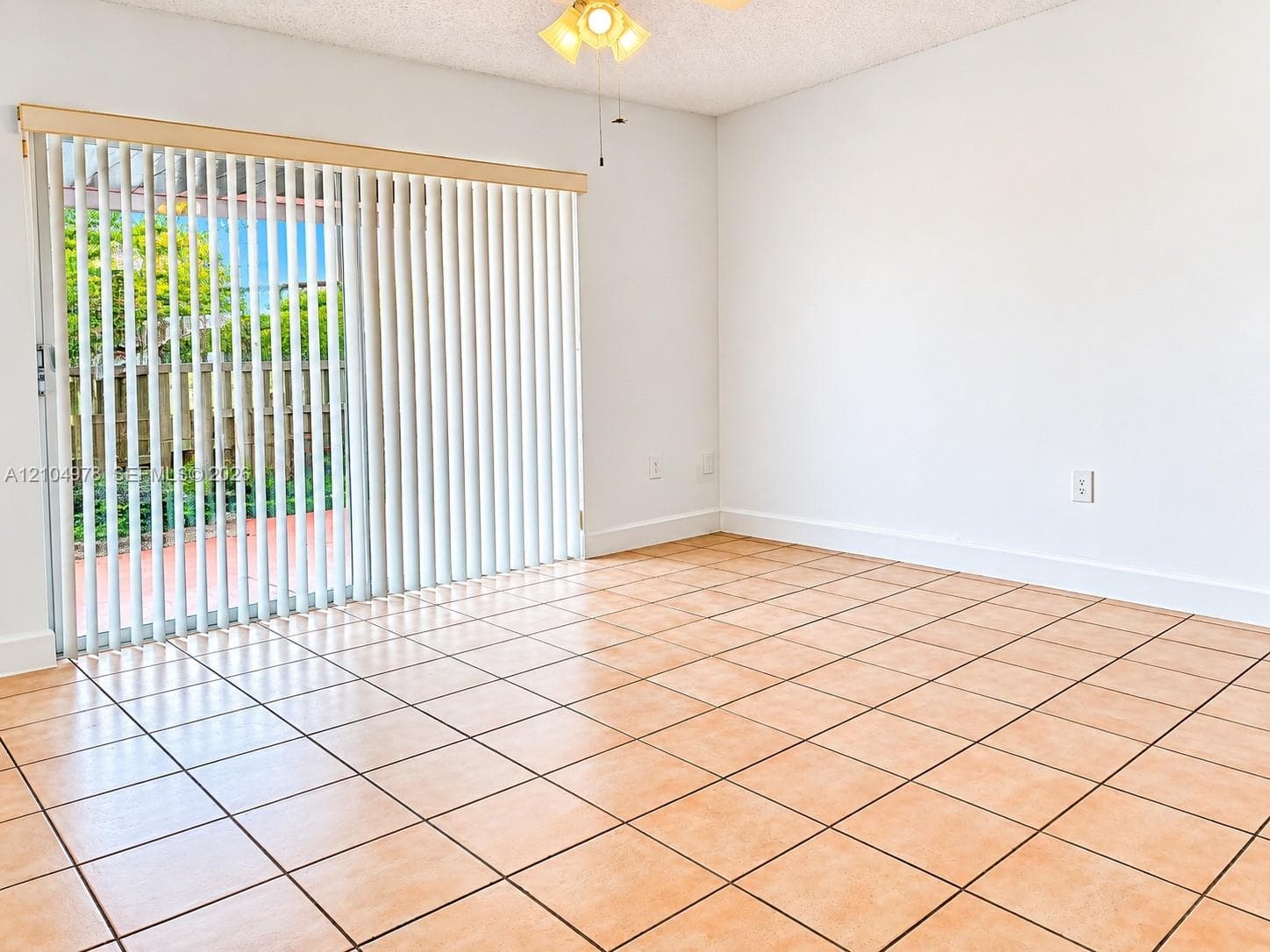 sliding glass door, vertical blinds, and ceiling fan