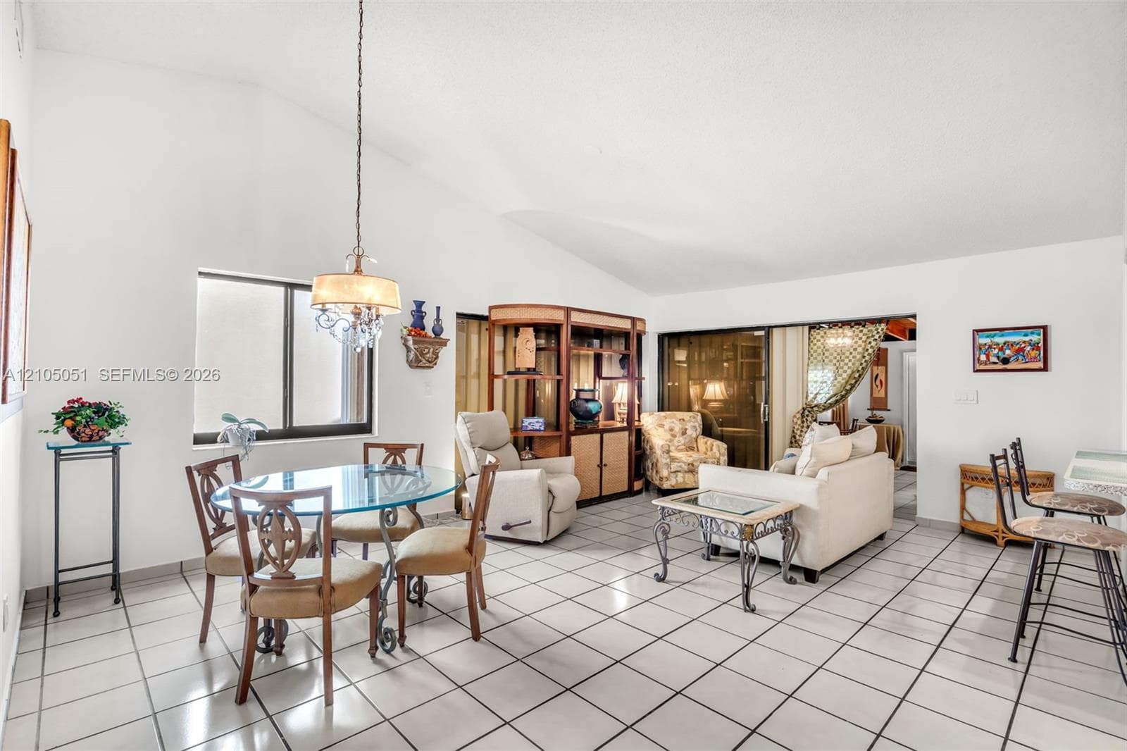 High-vaulted ceilings, neutral tile flooring