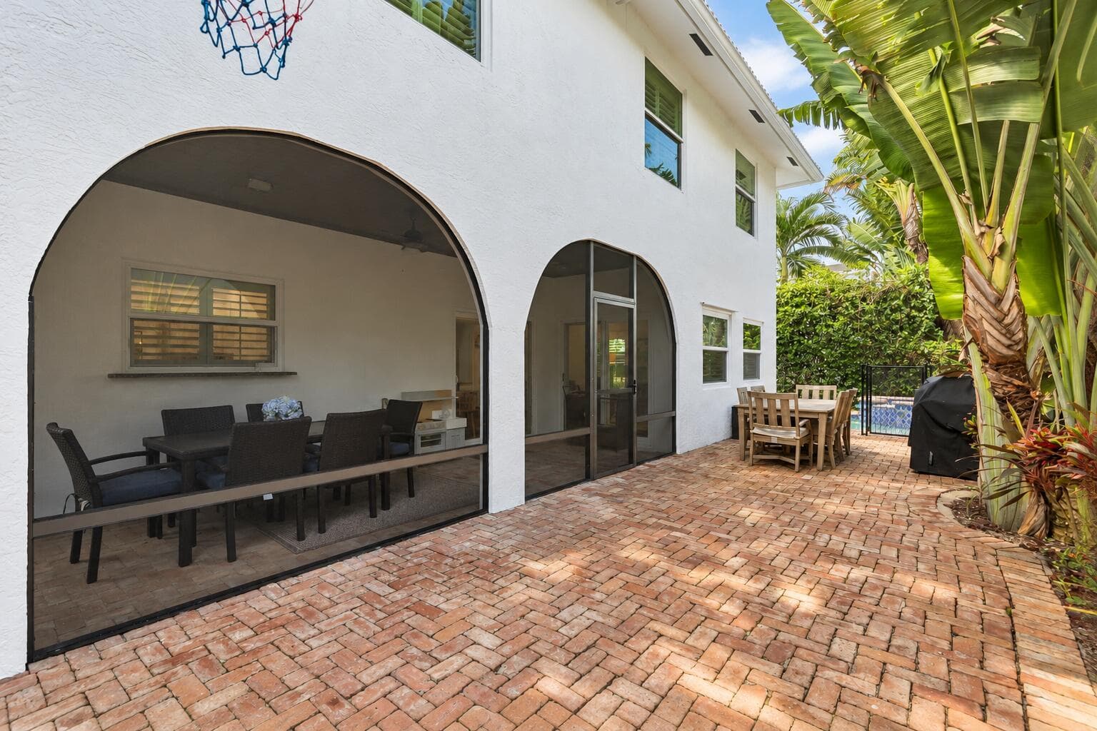 Sunny Florida Patio with Arched Screens