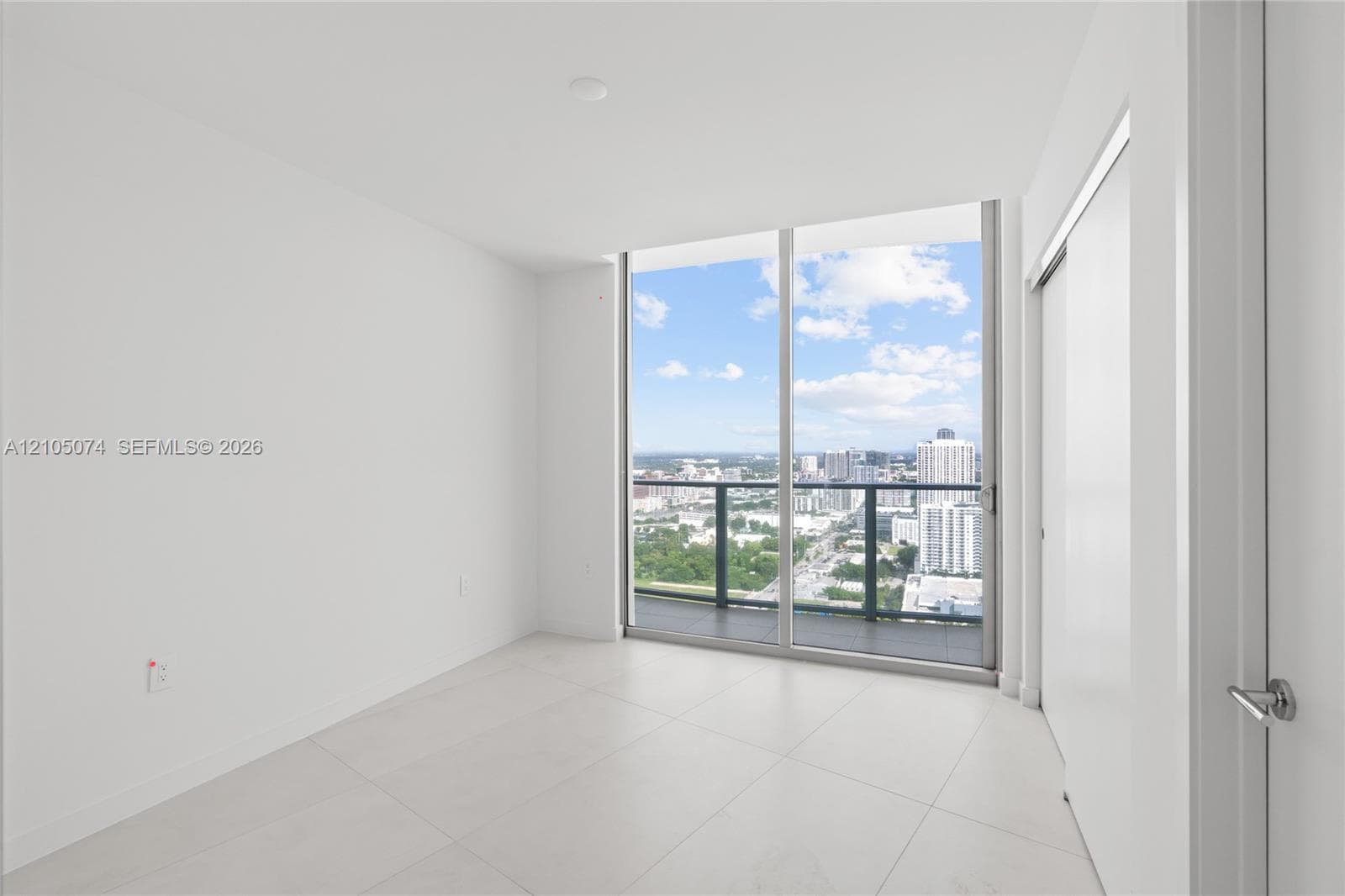 Elevated urban perspective featuring a metropolitan cityscape, high-rise architecture, and expansive horizon