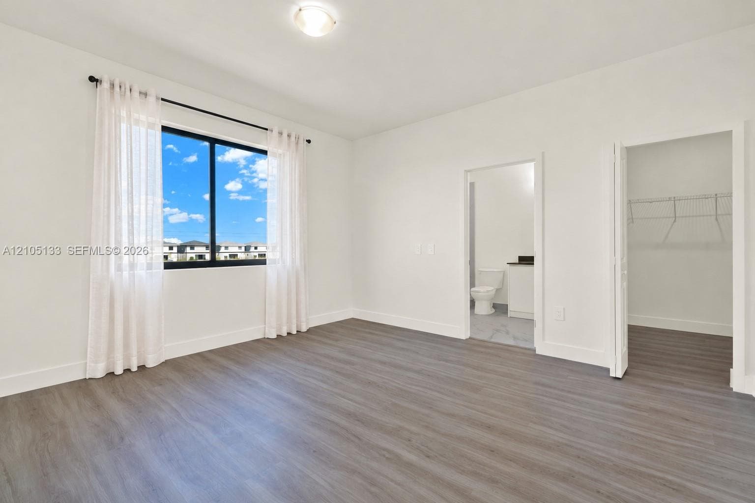 Wood-finish flooring with crisp white walls