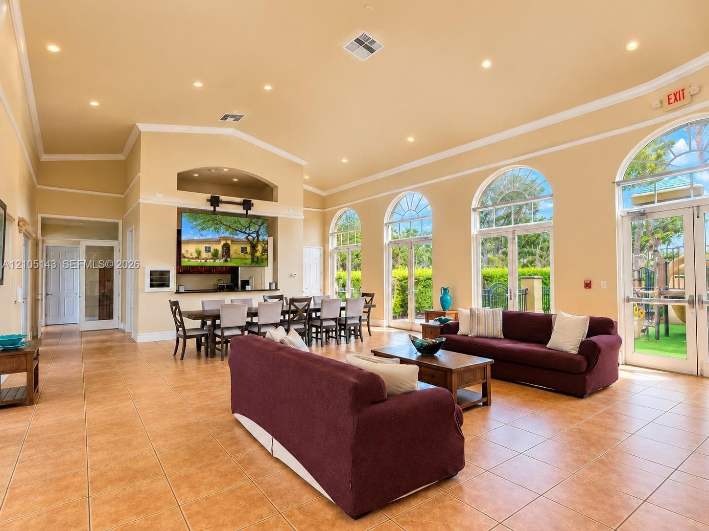 Expansive common area with high ceilings and recessed lighting