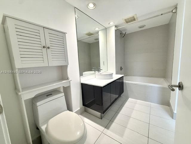 Bathroom featuring a high-gloss vanity with a white vessel sink, large wall-to-wall mirror, built-in over-the-toilet storage unit, and a bathtub with tile surround