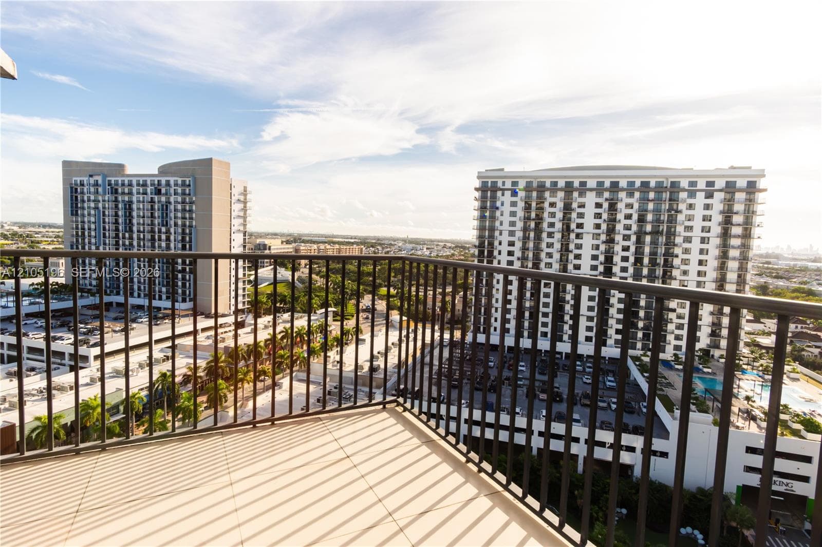 Balcony with tile flooring and black metal railings