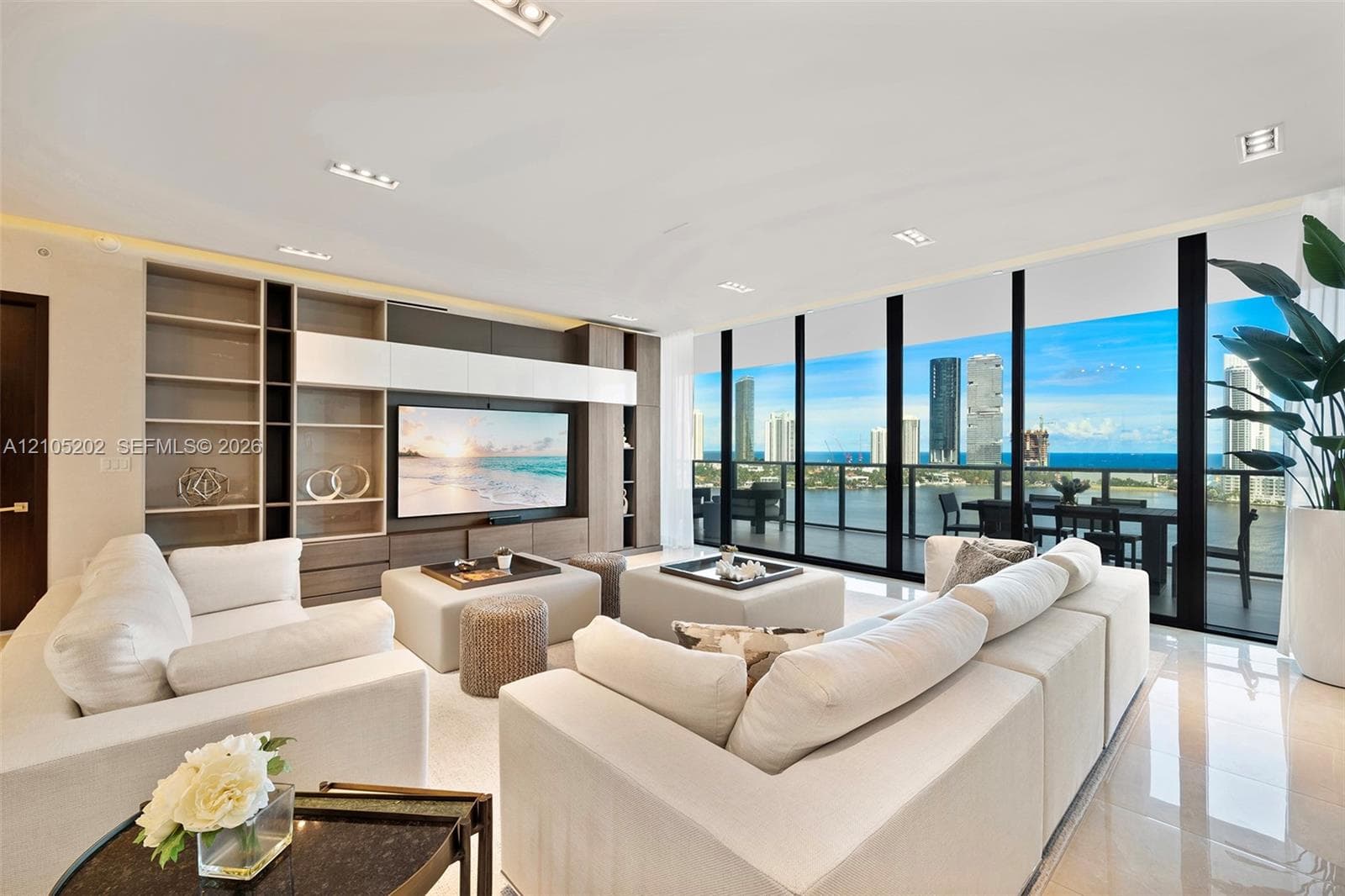 Floor-to-ceiling windows, built-in custom cabinetry, recessed lighting, and large-format tile flooring