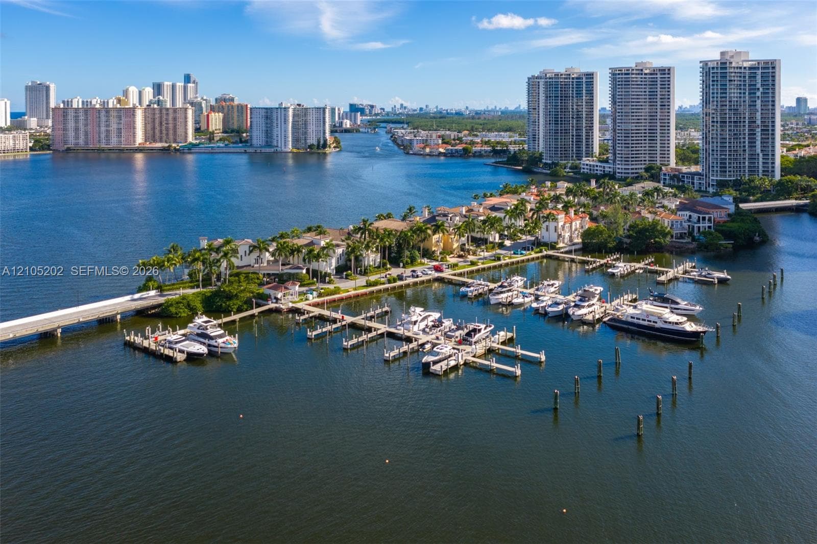 Waterfront peninsula featuring a deep-water marina with multiple boat slips, private dockage, and extensive coastal landscape
