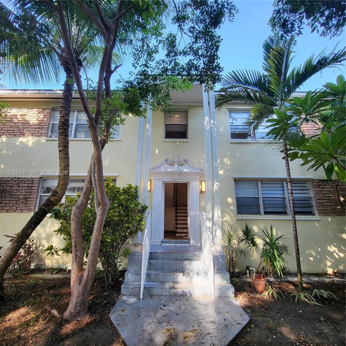 Stucco exterior with brick facade accents