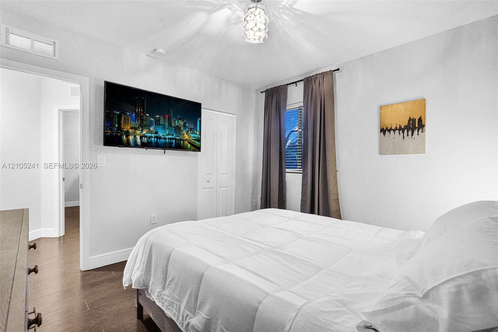 Hardwood-finish flooring, recessed lighting, and a modern ceiling fixture