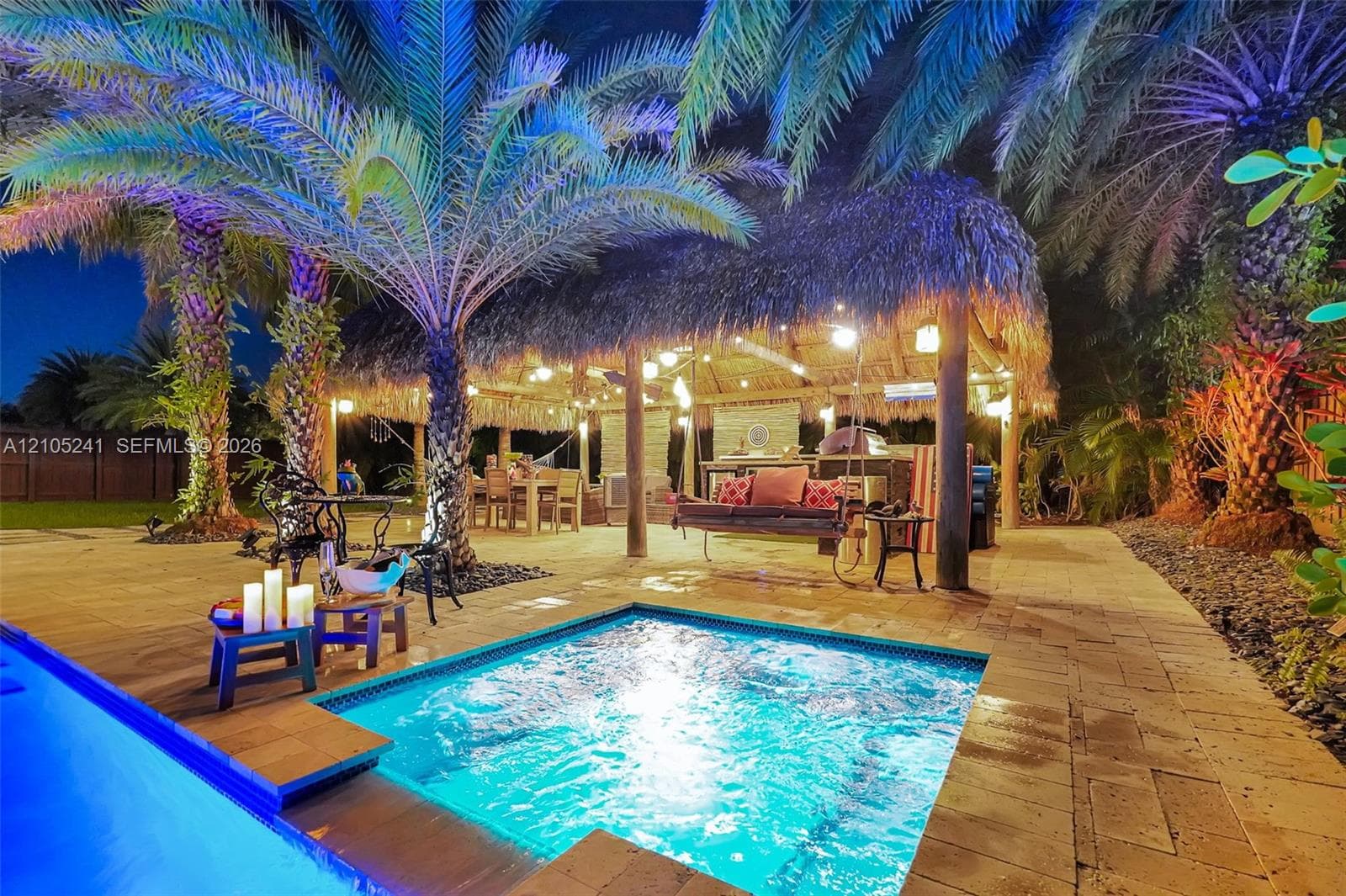Swimming pool with integrated spa and wood-finish decking