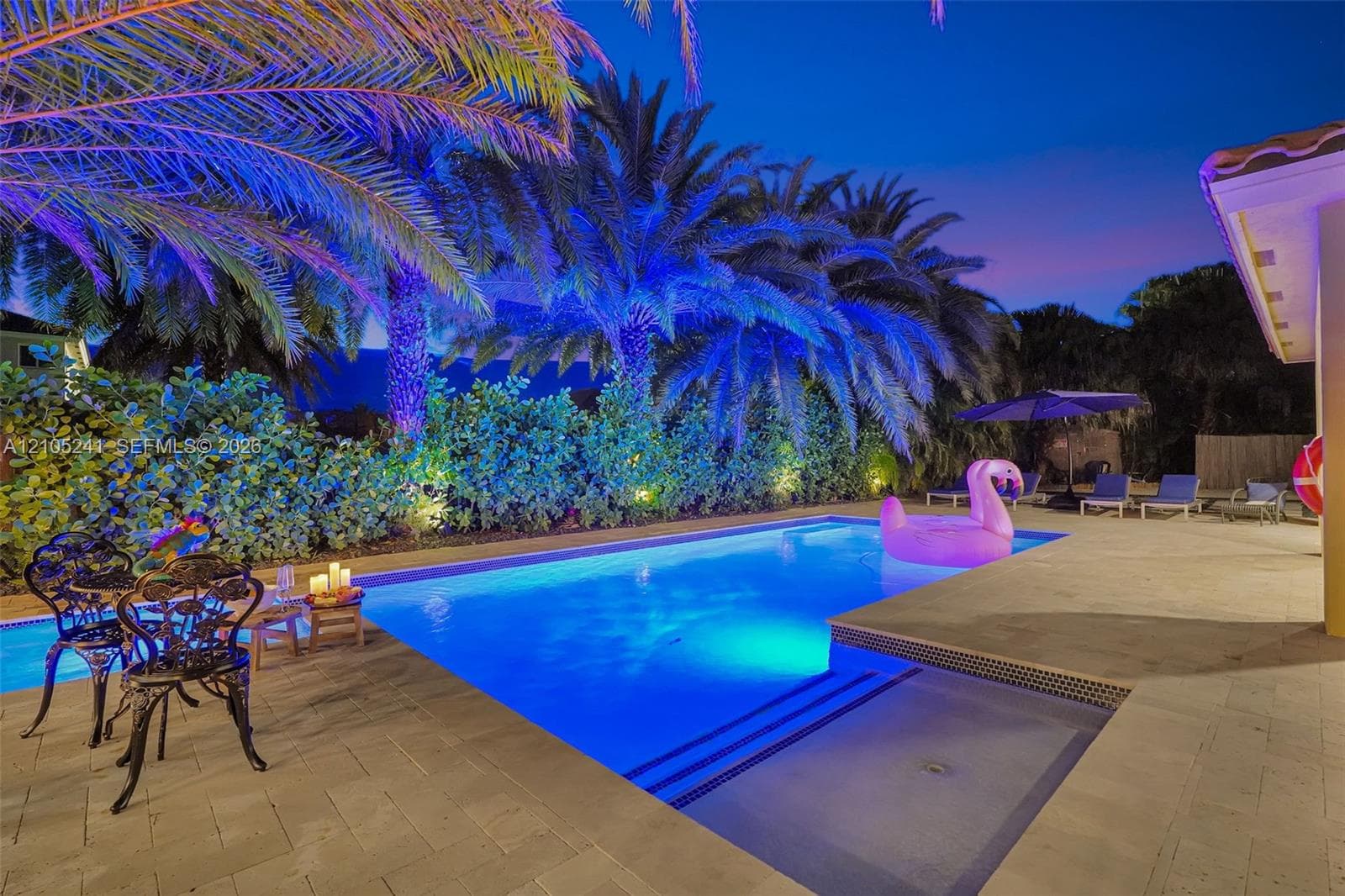 Resort-style pool with integrated spa and ample patio space