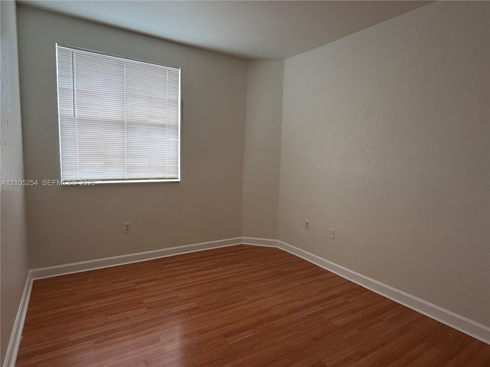 Light-toned walls complement wood-finish flooring