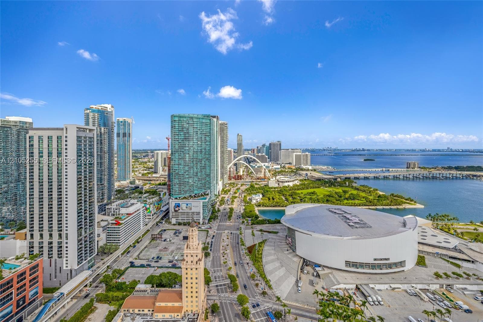 Elevated aerial perspective featuring high-rise urban density, direct proximity to waterfront infrastructure, and expansive metropolitan scenery