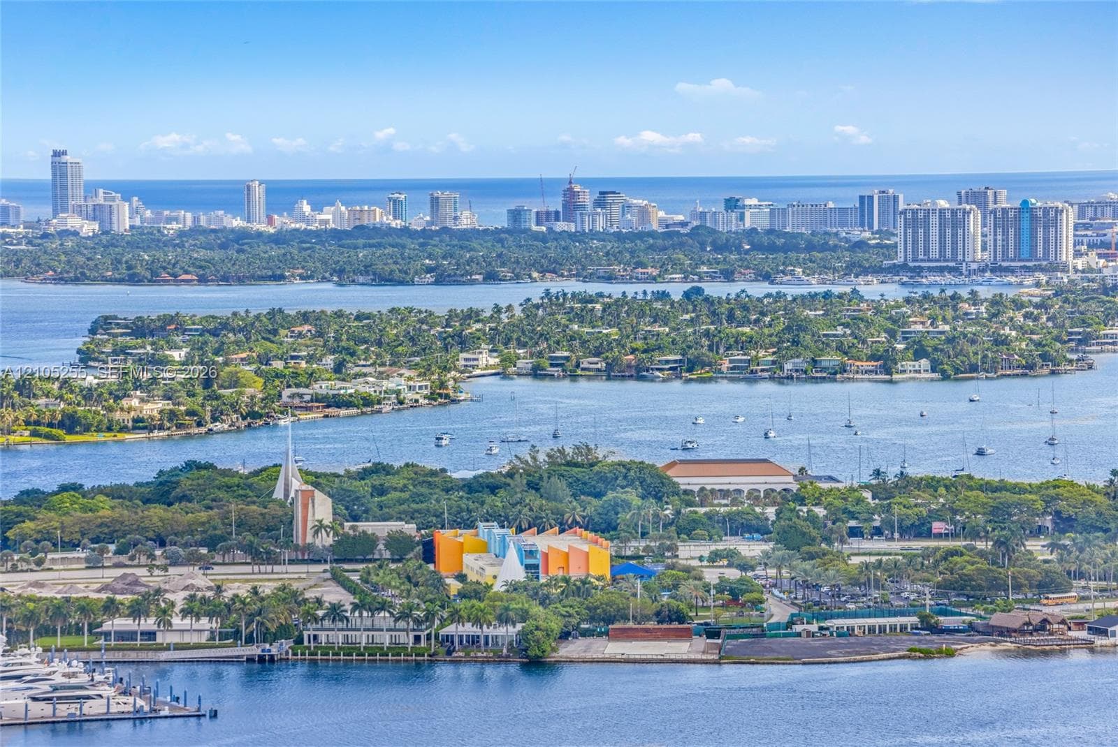 Aerial perspective featuring expansive waterway frontage, deep-water marina access, and unobstructed skyline horizons