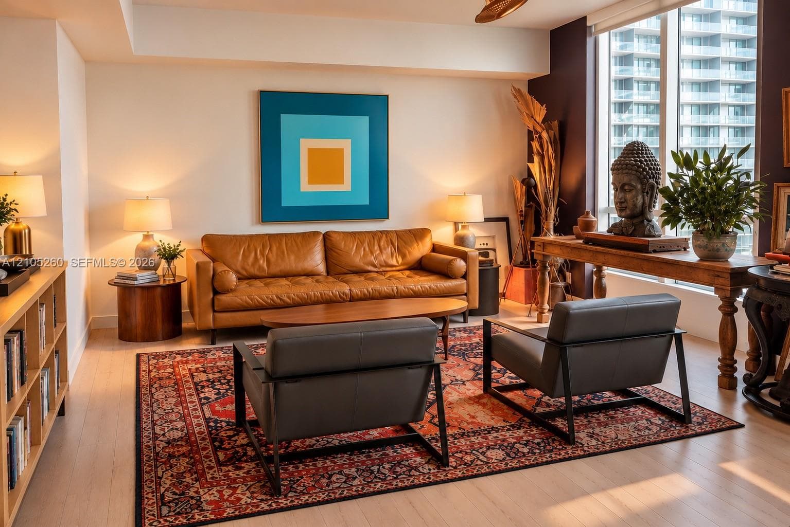 Living space featuring floor-to-ceiling windows, light-toned wood-finish flooring, and built-in shelving