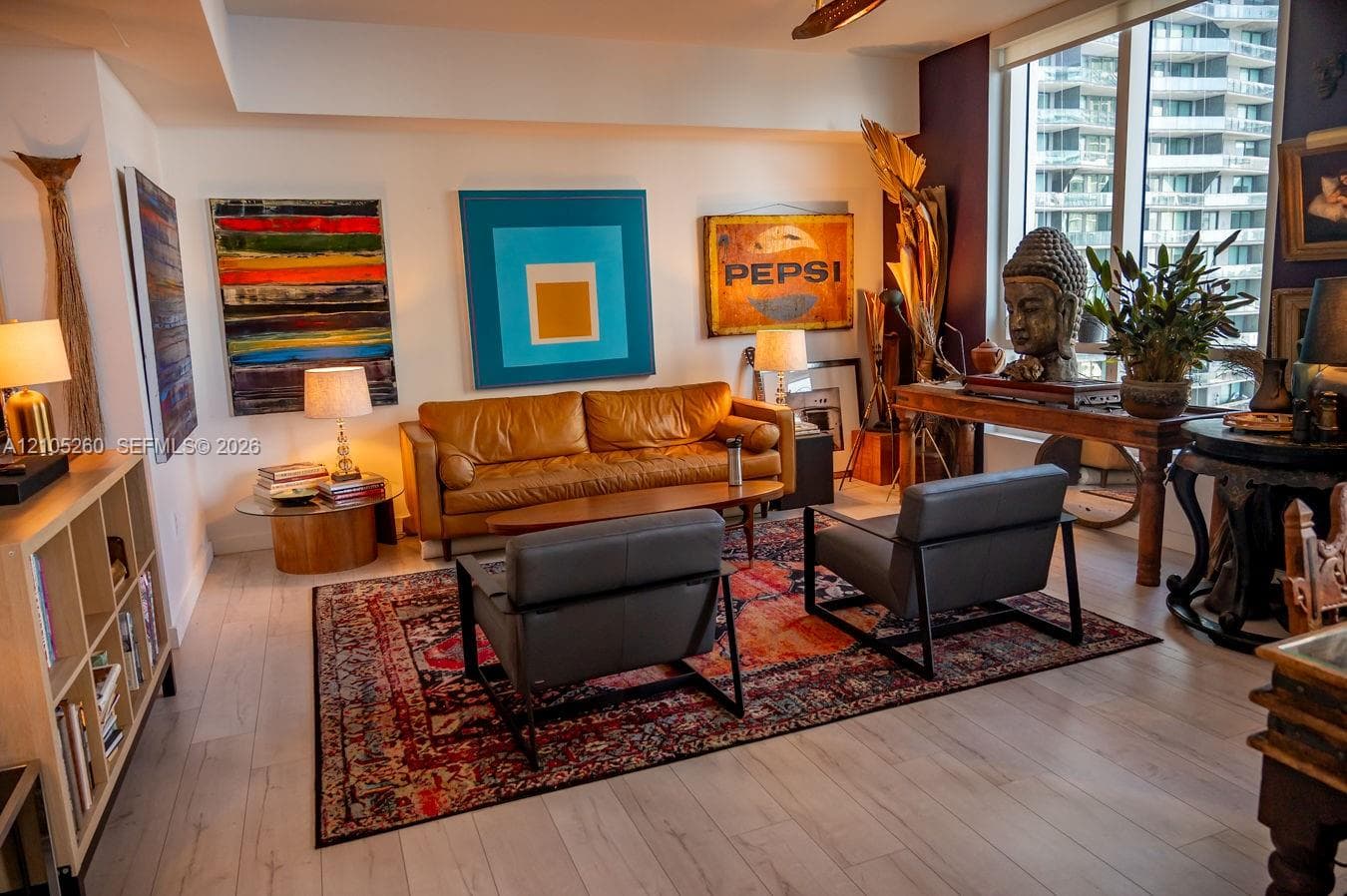 Light wood-finish flooring throughout, complemented by a floor-to-ceiling window