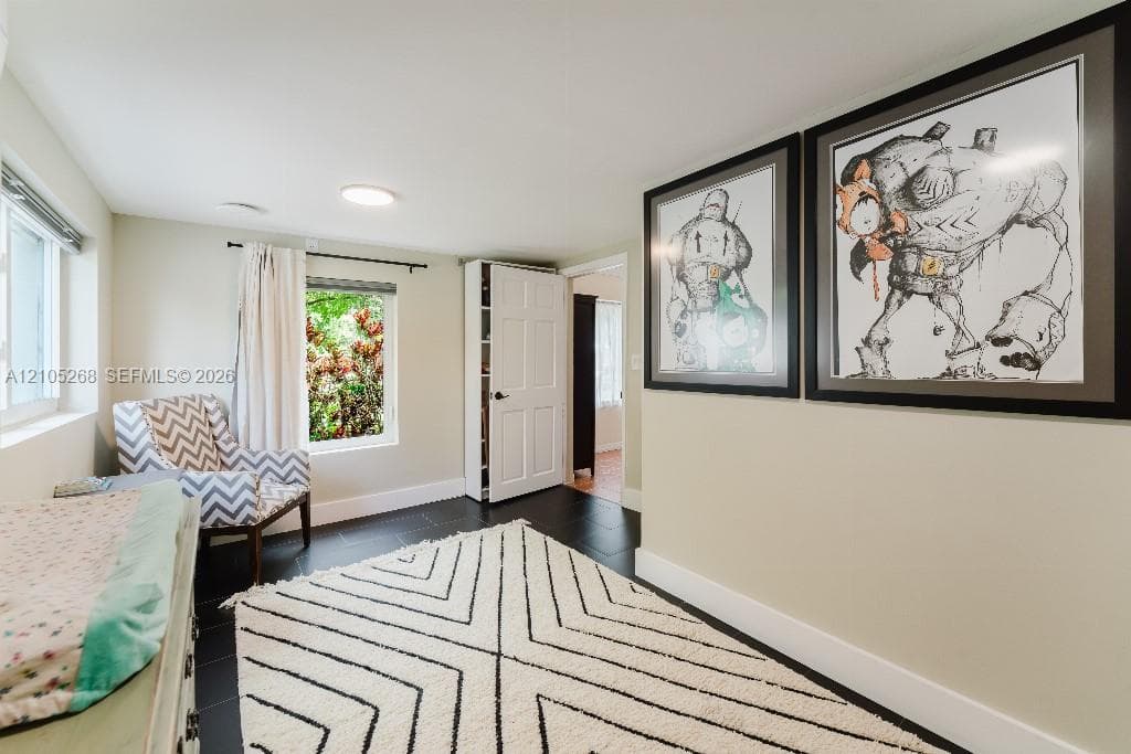Recessed ceiling lighting, dark wood-finish flooring, and white interior doors