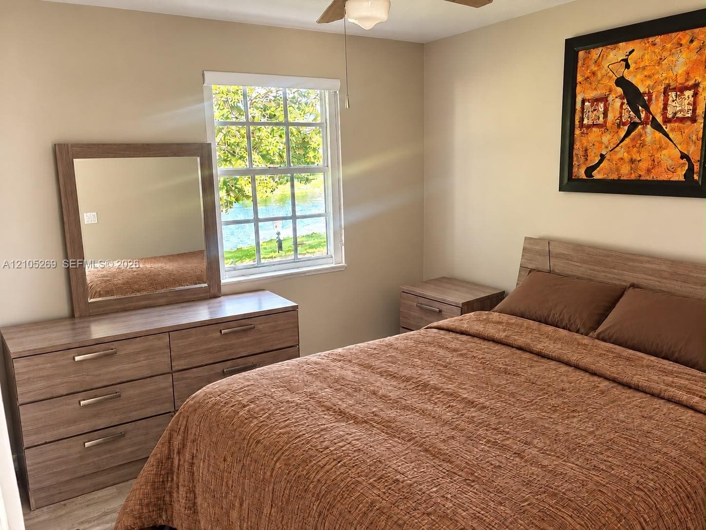 Neutral wall color with a window providing natural light and a water backdrop