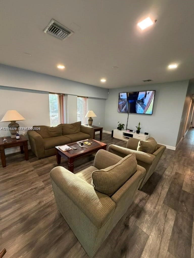 Wood-finish flooring with a large game table