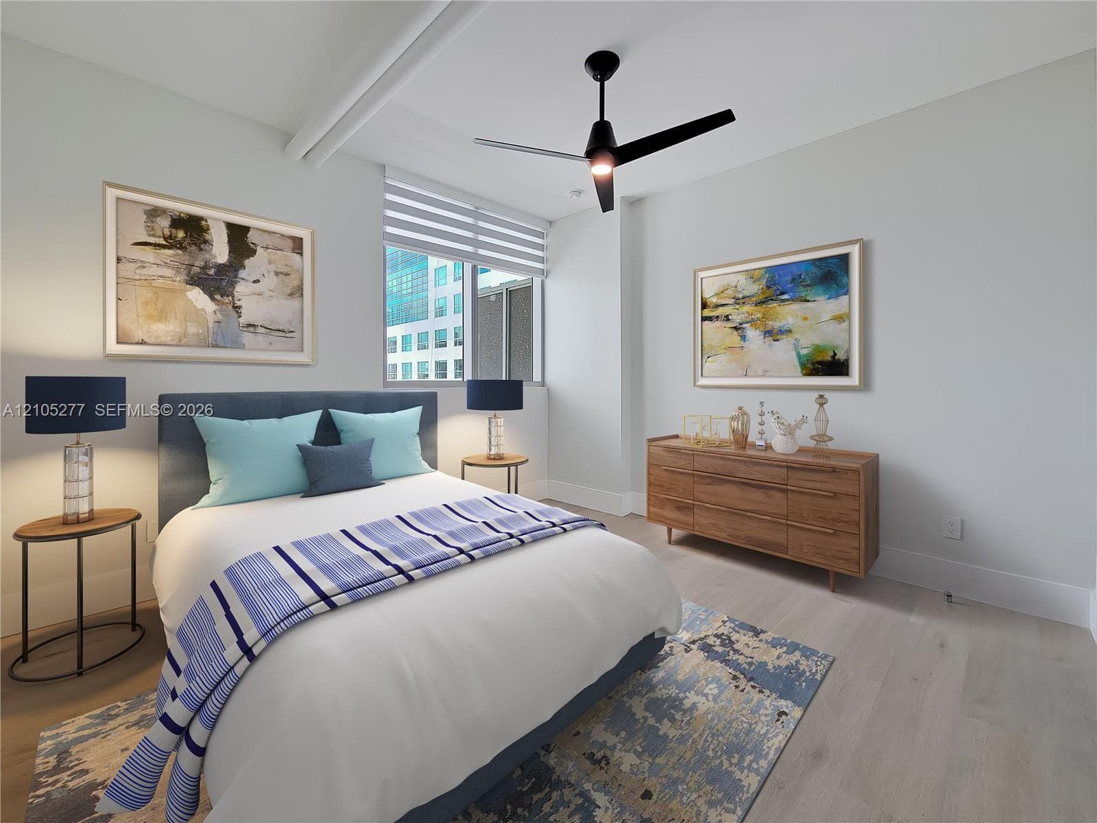 Wood-finish flooring, high ceilings, large window with blinds, and a contemporary ceiling fan