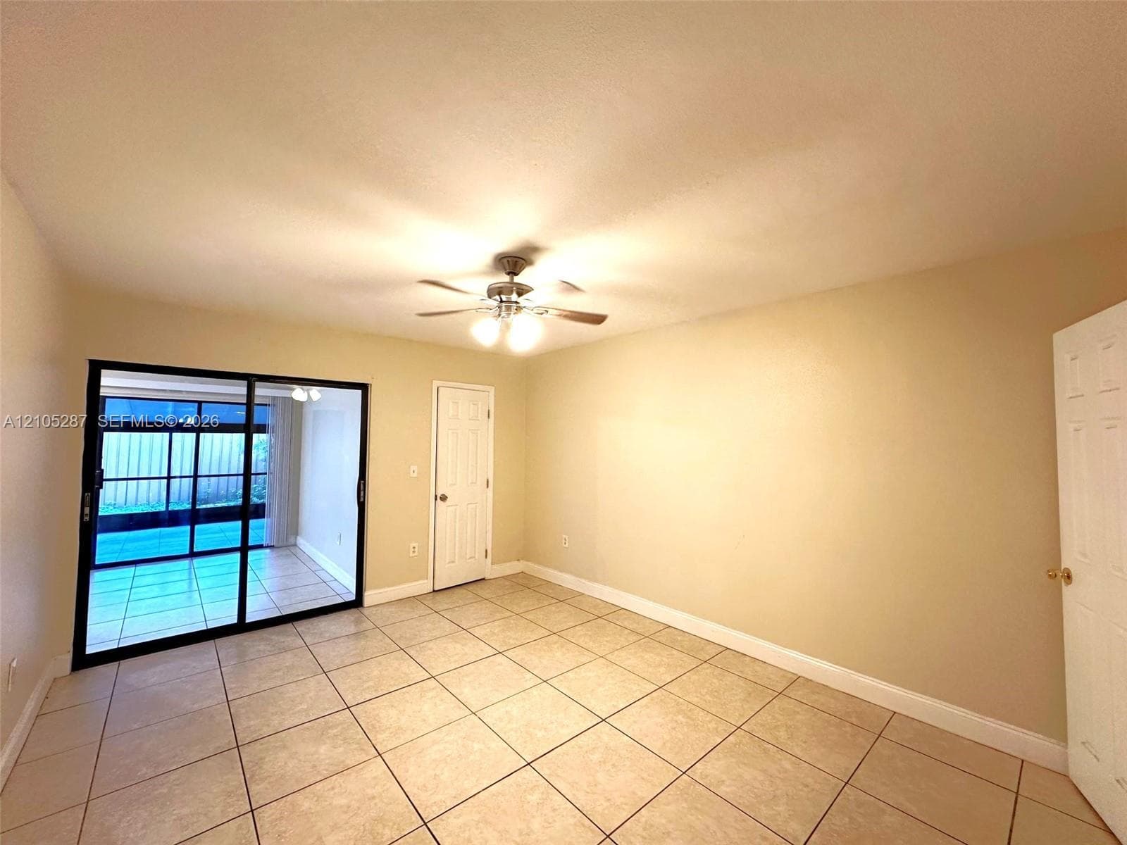Neutral-toned walls complement the tile flooring