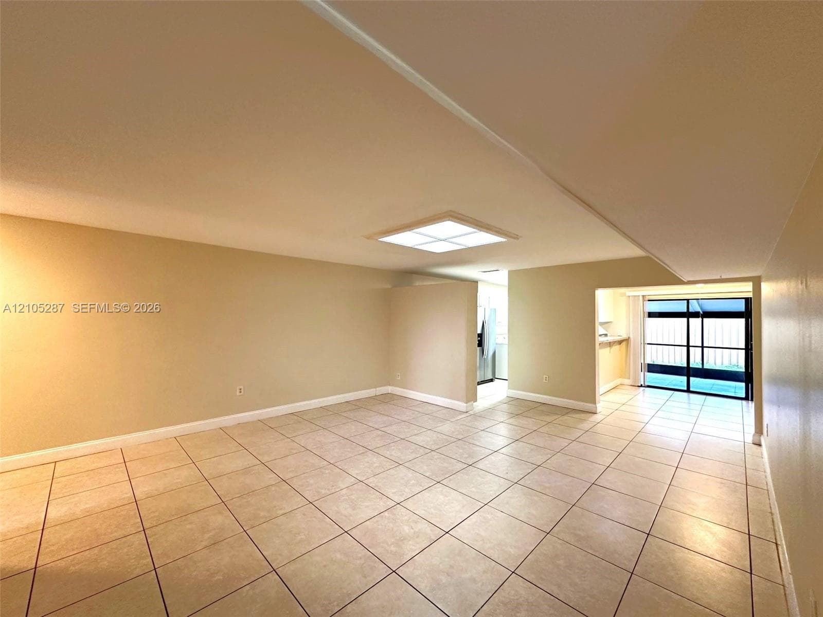 Expansive tiled flooring and neutral wall tones