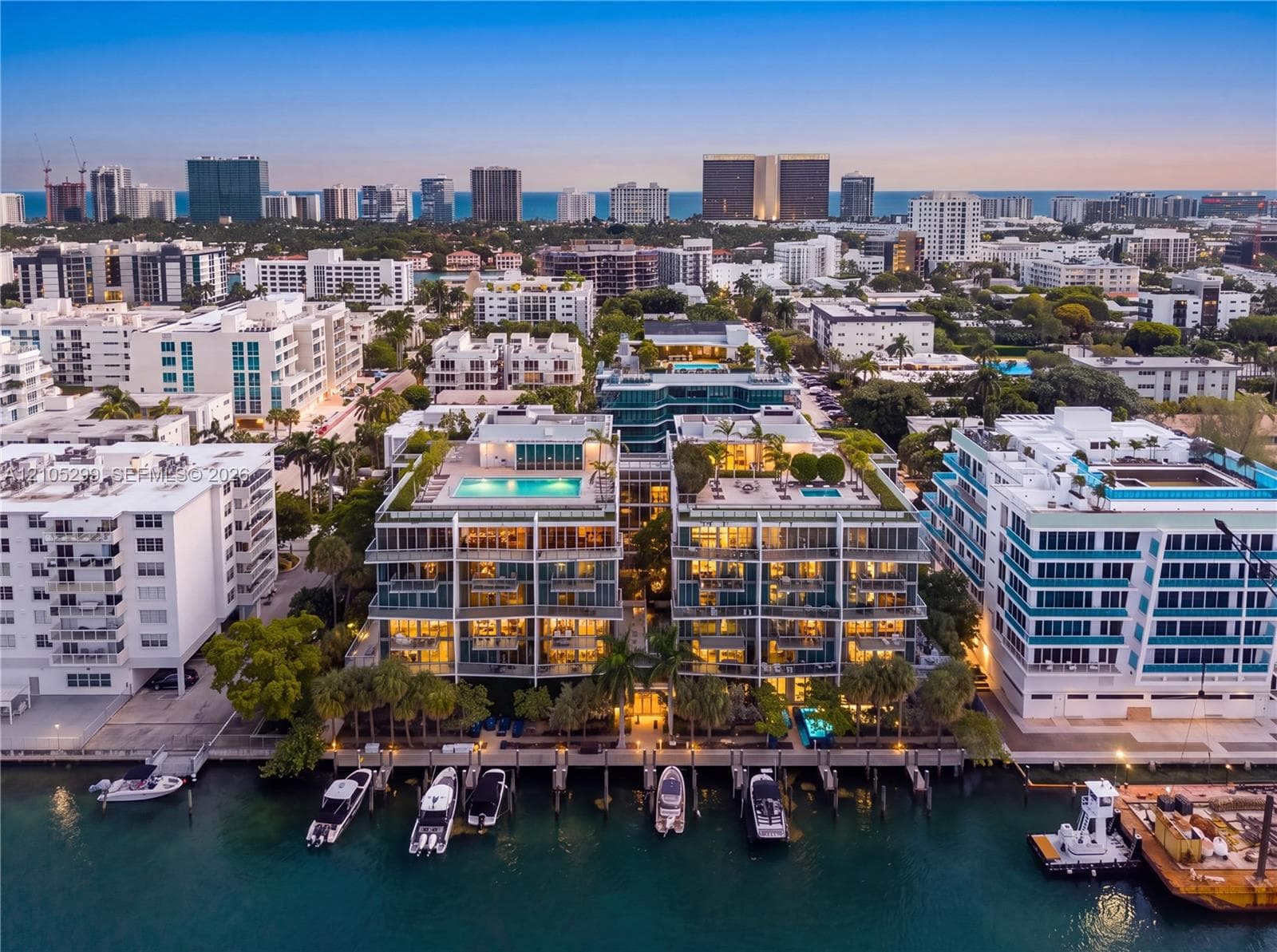 Waterfront property featuring multiple boat slips, rooftop pools, and extensive balconies