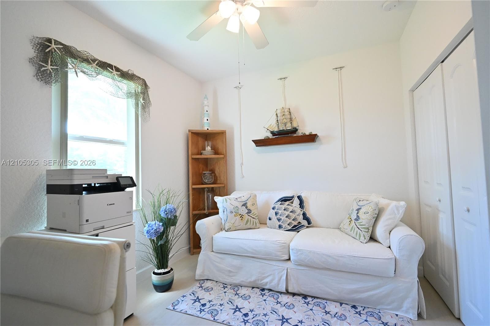White walls, light-toned flooring, and a ceiling fan
