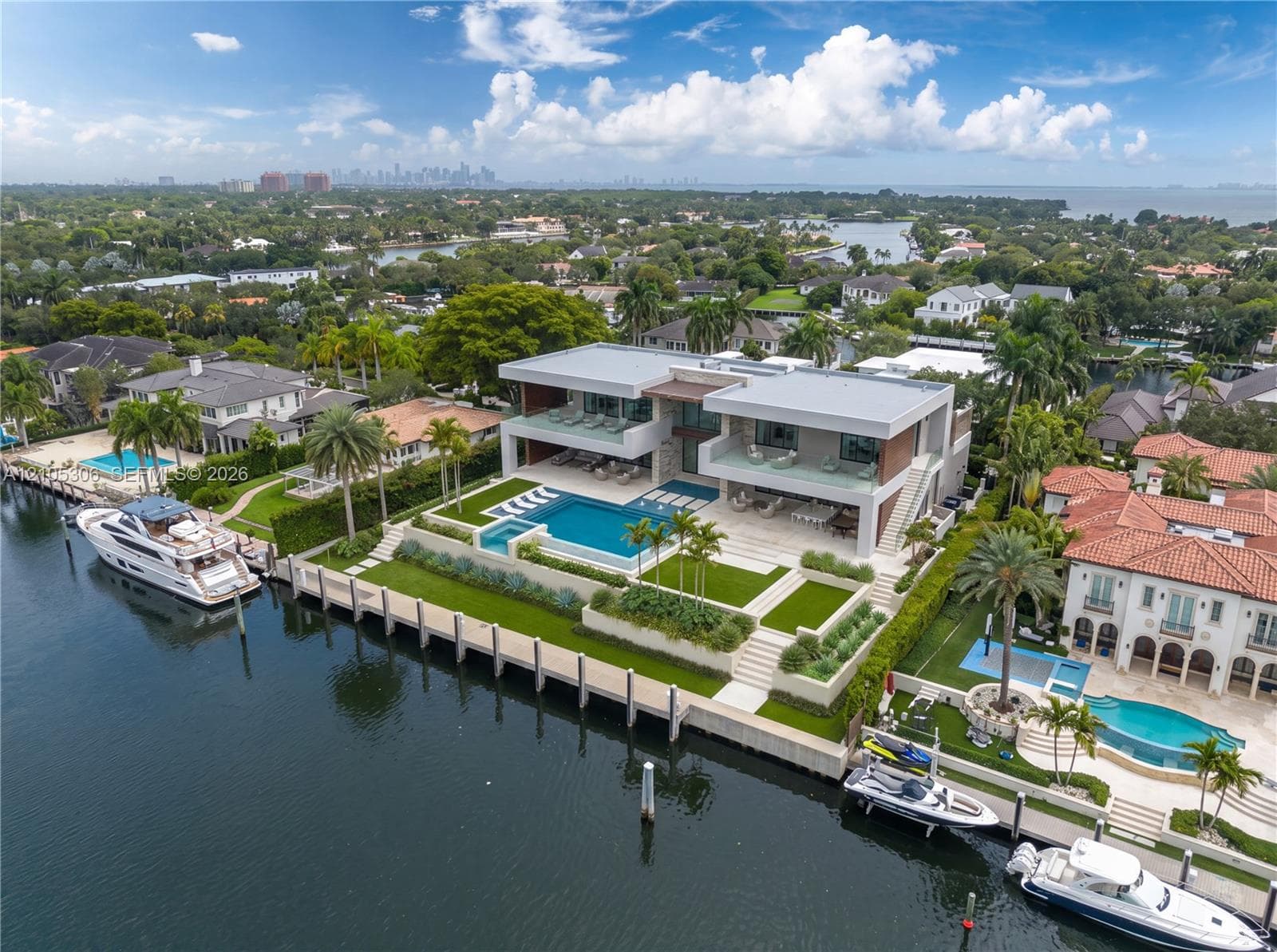 The property can accommodate an approximately 100-foot yacht, while the wide bay beyond provides the maneuvering room a vessel of this scale requires.