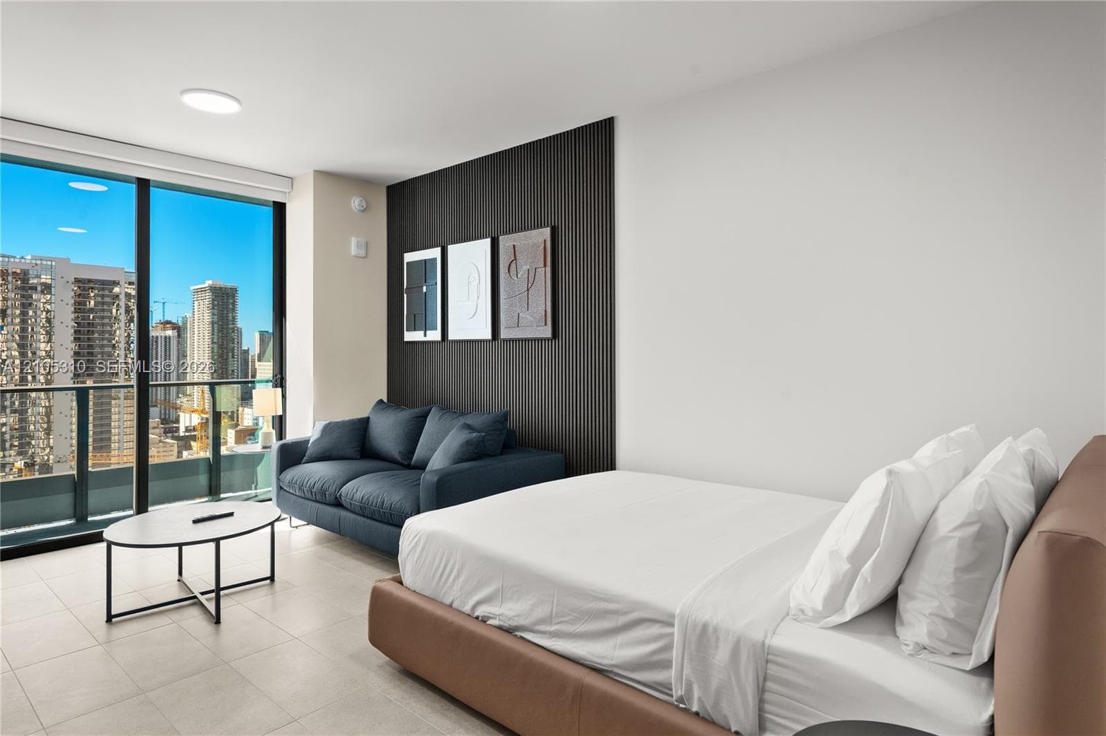 Expansive window wall with city backdrop