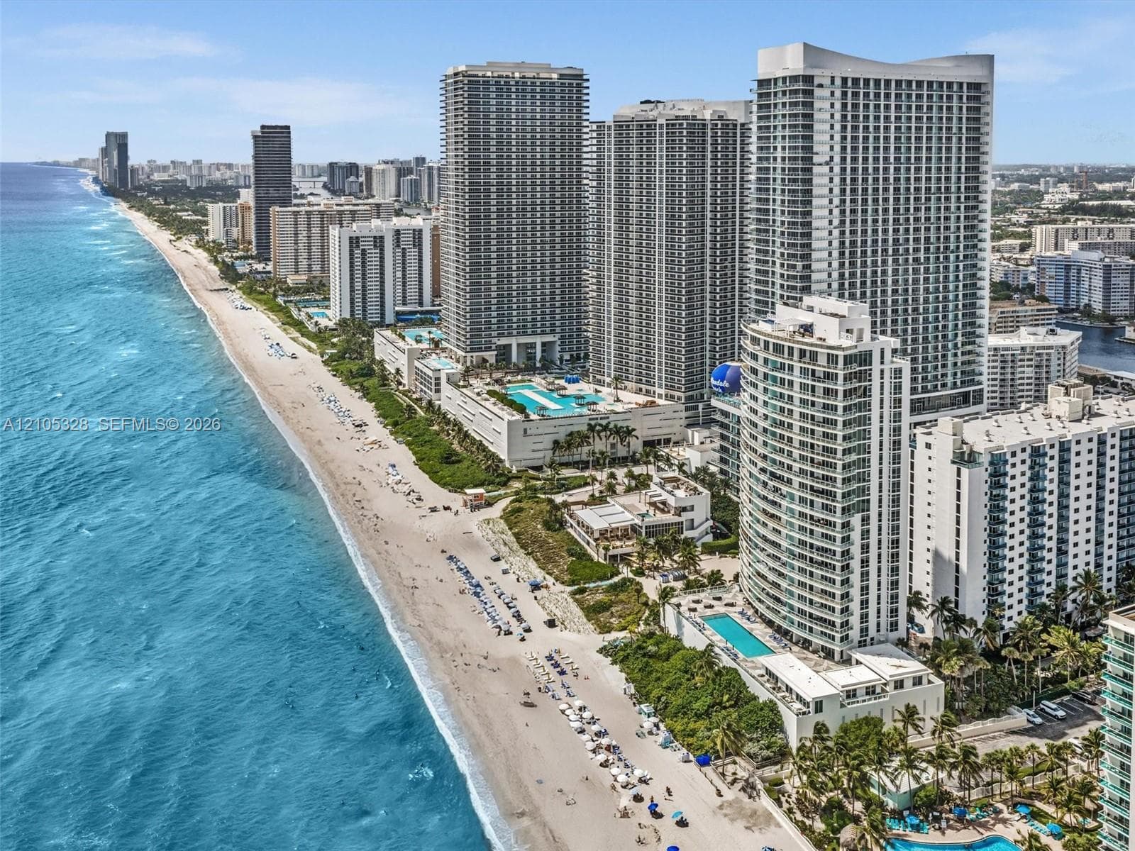 Experience luxury oceanfront living at Apogee Beach, featuring direct beach access, resort-style pools, and amenities, and exceptional coastal lifestyle.