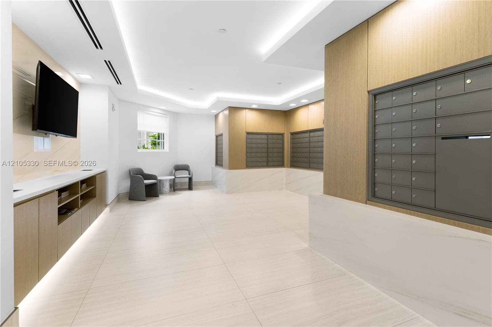 Recessed ceiling lighting, wood-finish wall panels, built-in cabinetry, and tile flooring