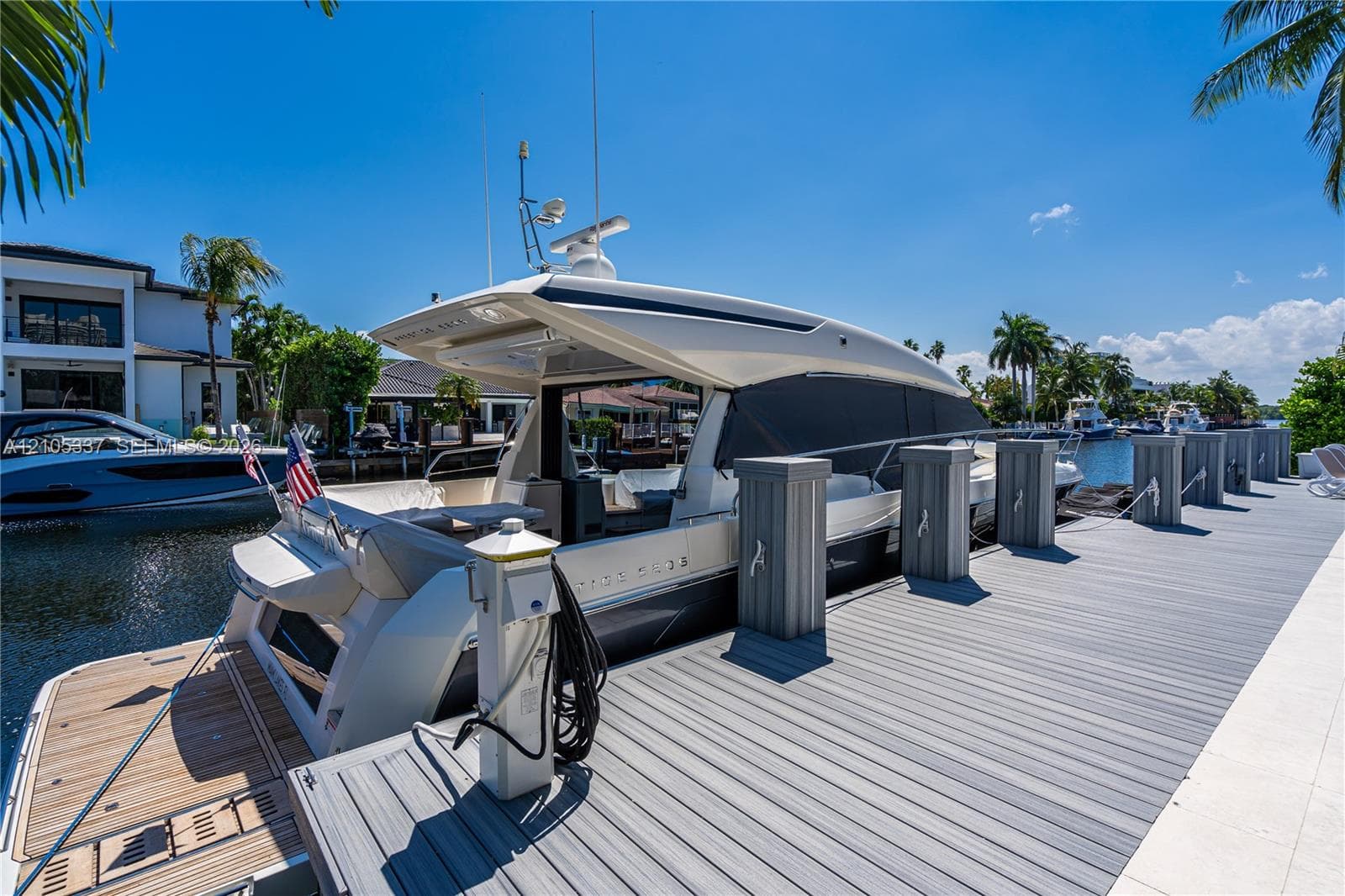 Private deep-water dock featuring composite decking, integrated power pedestals, and structural pilings