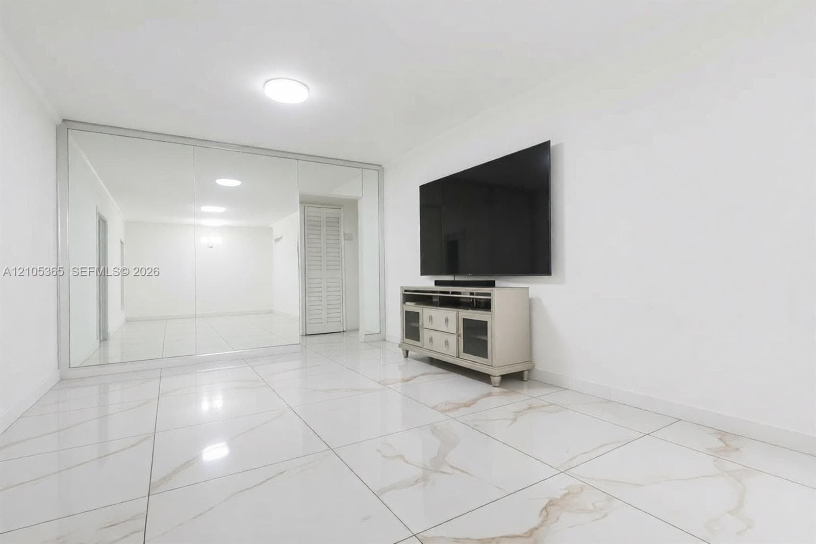 White walls with full-height mirrored panels