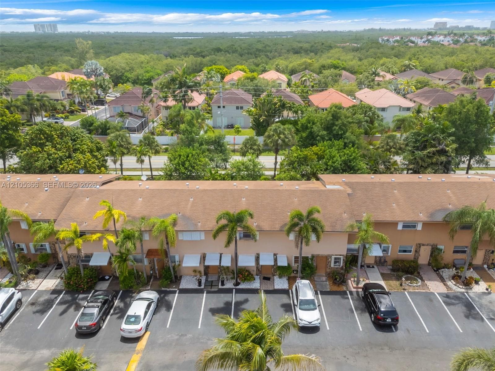 Townhome-style residences featuring individual entrances and awnings