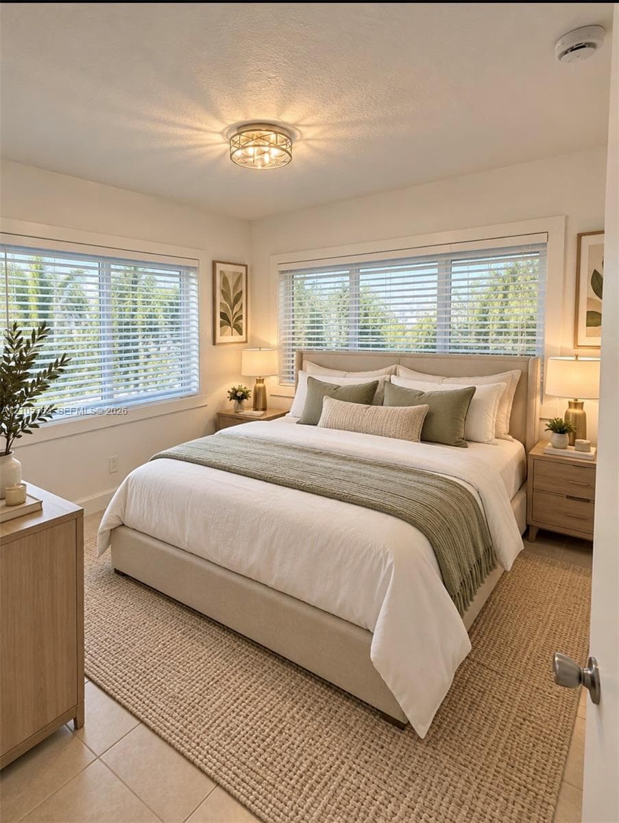 Recessed lighting fixture, dual windows with blinds, light-toned tile flooring, and a neutral color palette staging virtual