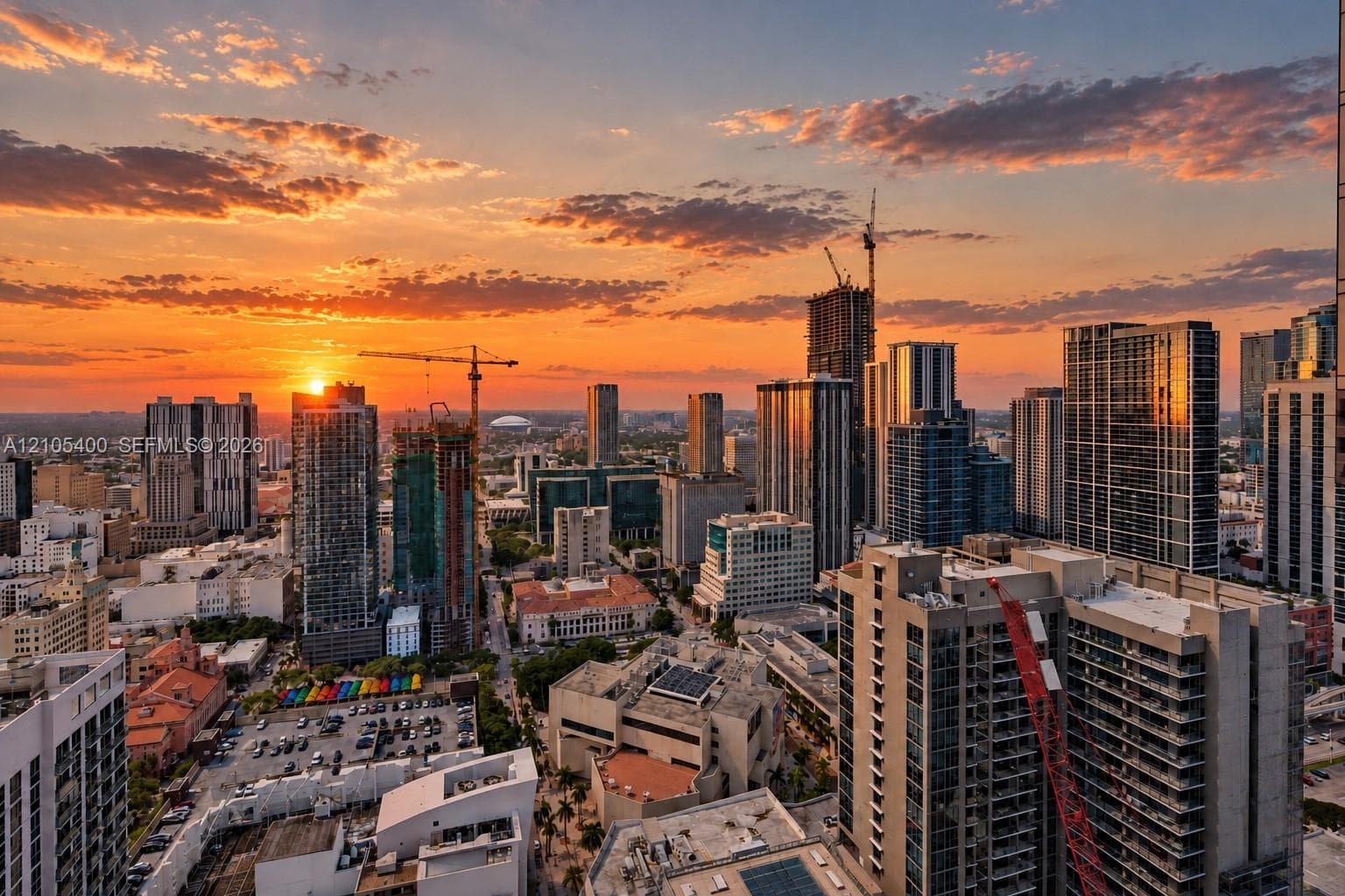 Aerial perspective showcasing a dense urban landscape featuring high-rise buildings and commercial structures