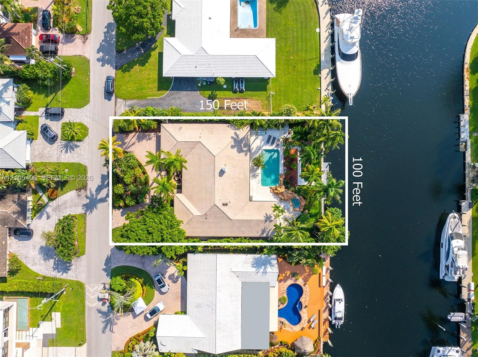 Waterfront property with private boat dockage, a swimming pool, and an integrated spa