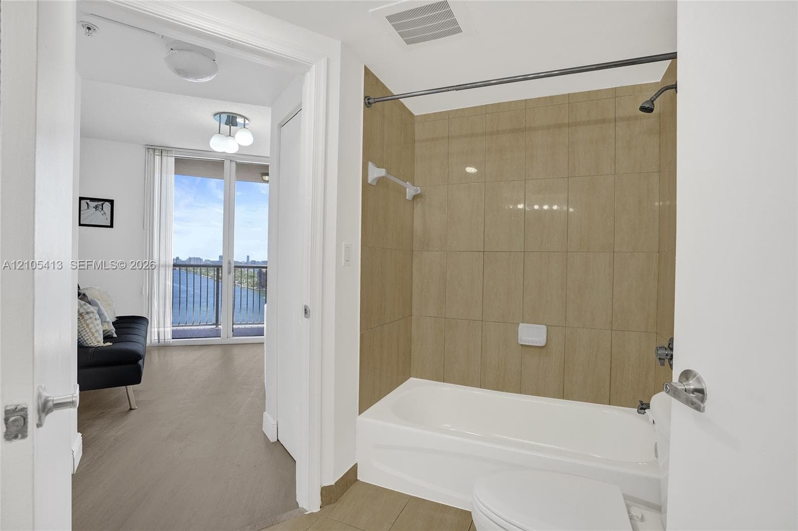 Porcelain tiled shower with a built-in tub