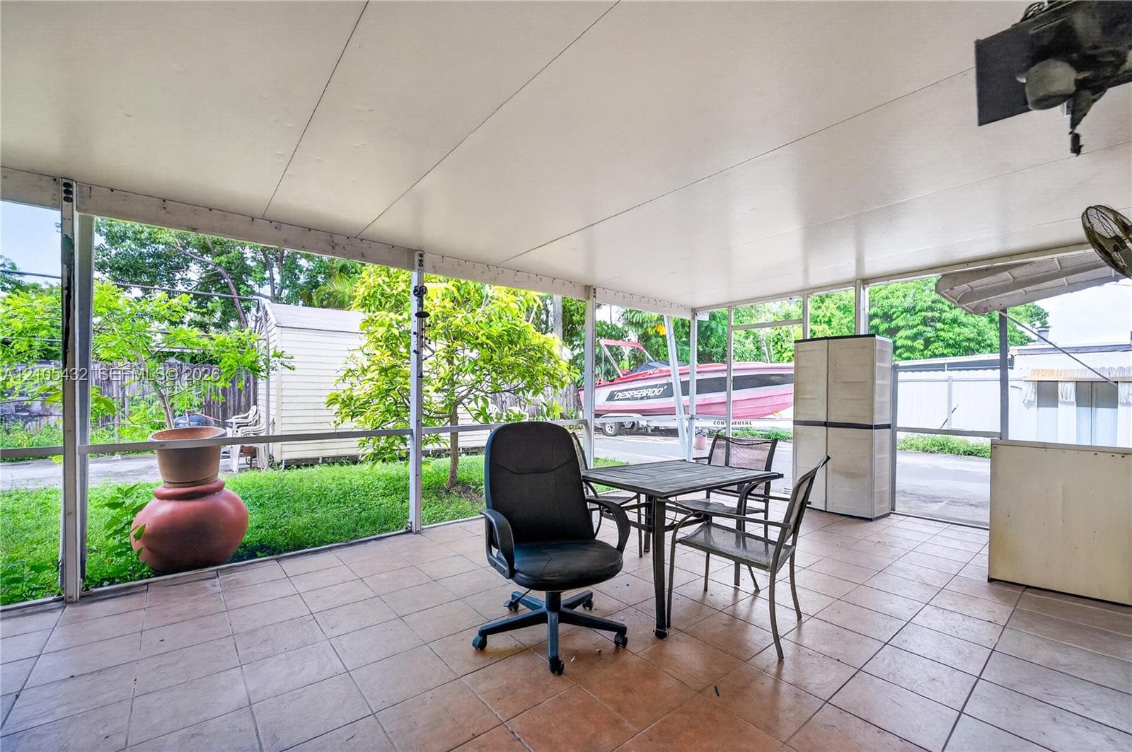 Screened-in patio featuring tiled flooring, a covered ceiling, and metal framing