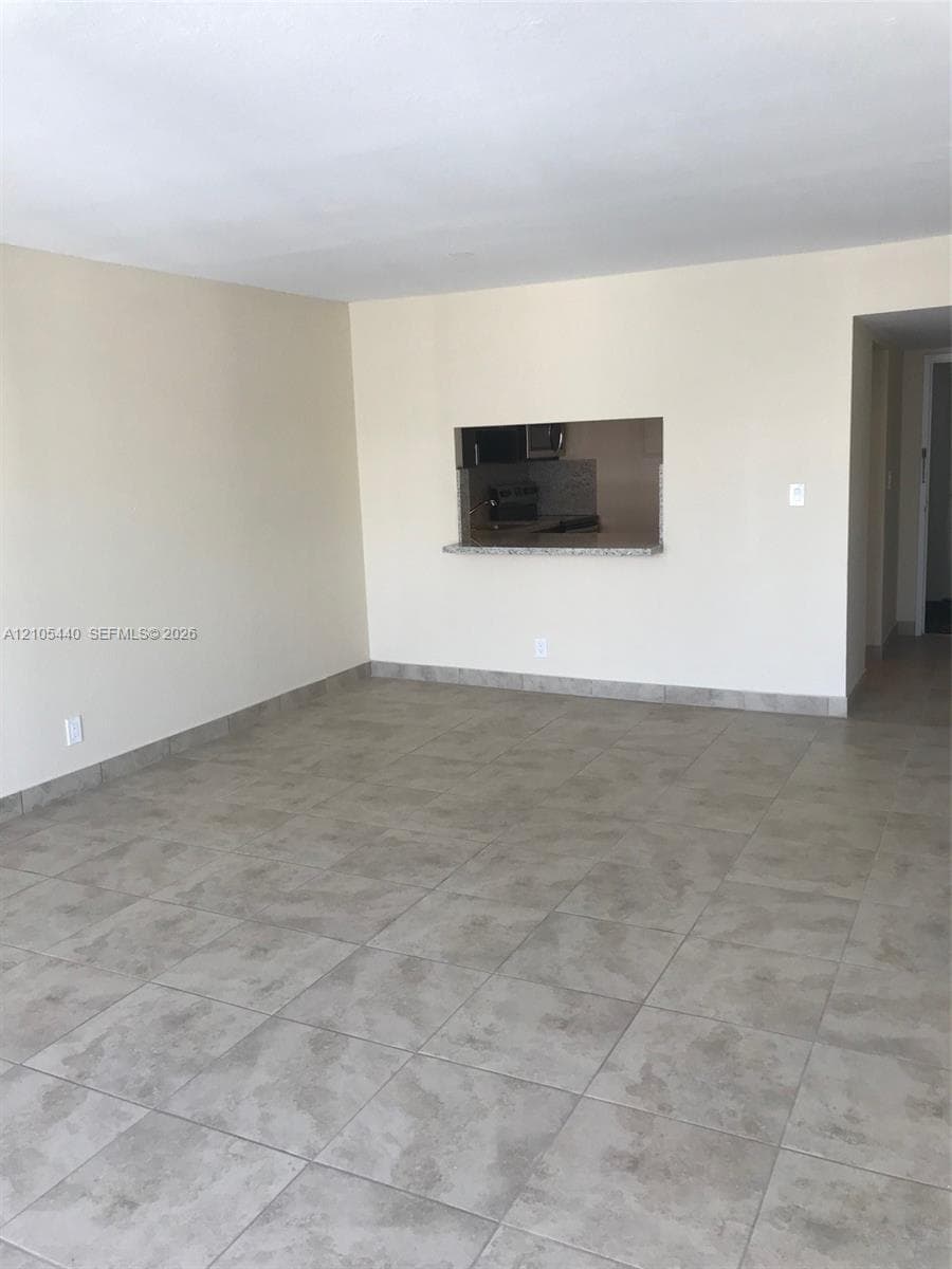 Neutral-toned tile flooring throughout