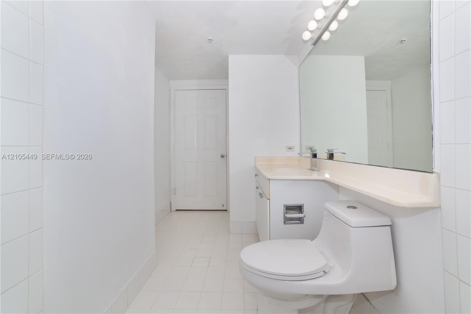 White tile flooring and wall accents
