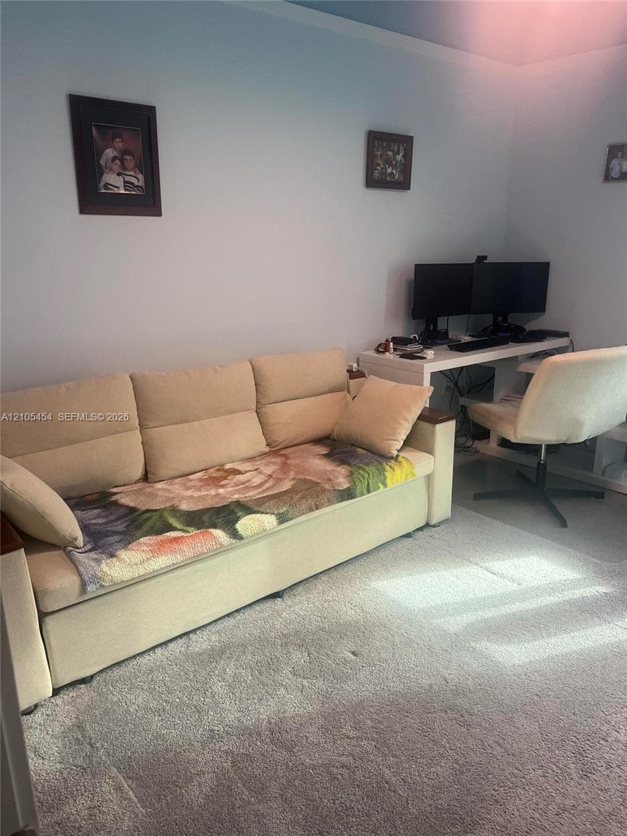 Light blue wall paint and light gray carpeting