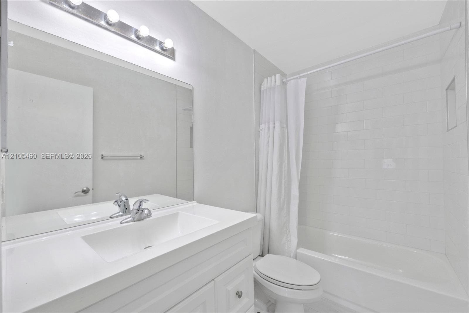Single vanity with an integrated sink and chrome faucet